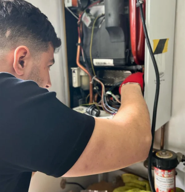 member of the team repairing the boiler