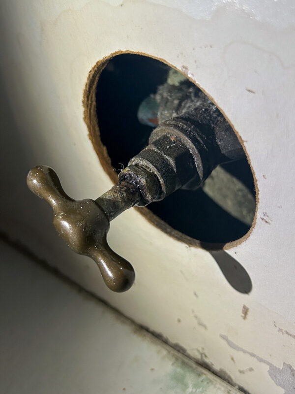 Stopcock located in a kitchen cupboard