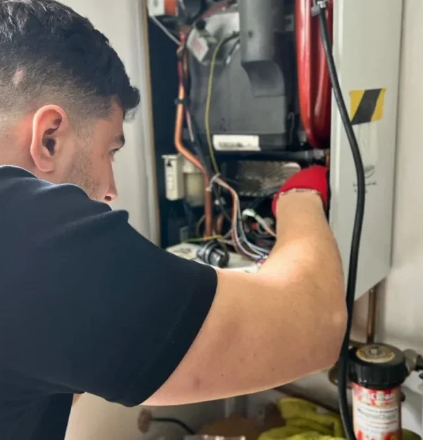 member of the team repairing the boiler