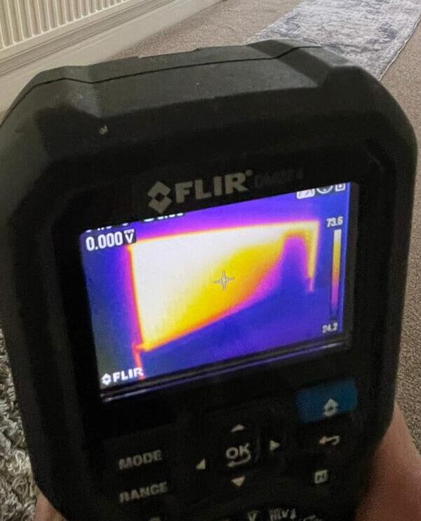 Thermal imaging camera showing the effects of limescale and other build-up in a radiator in Milton Keynes.
