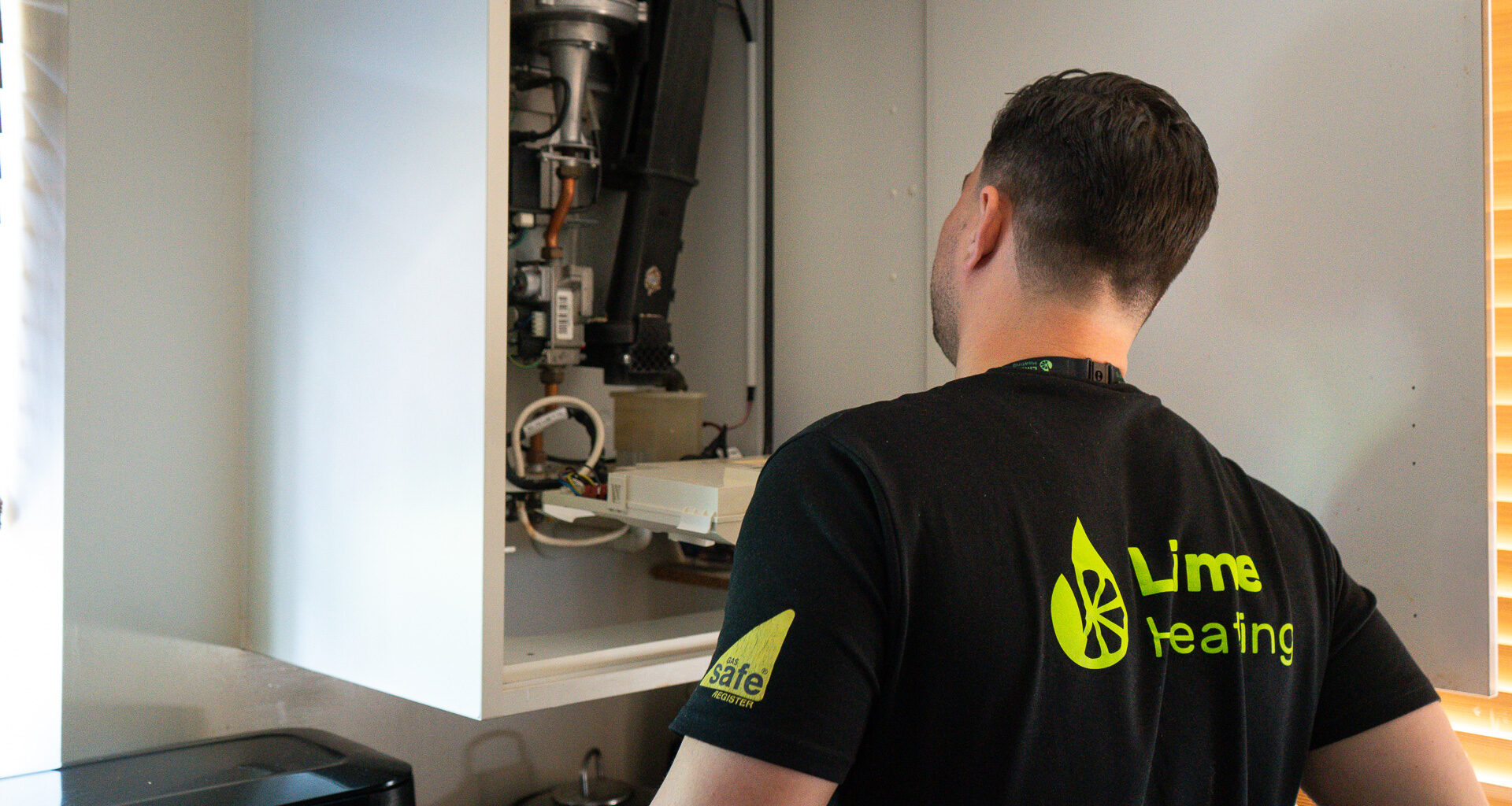 Lime Heating engineer assessing a boiler issue