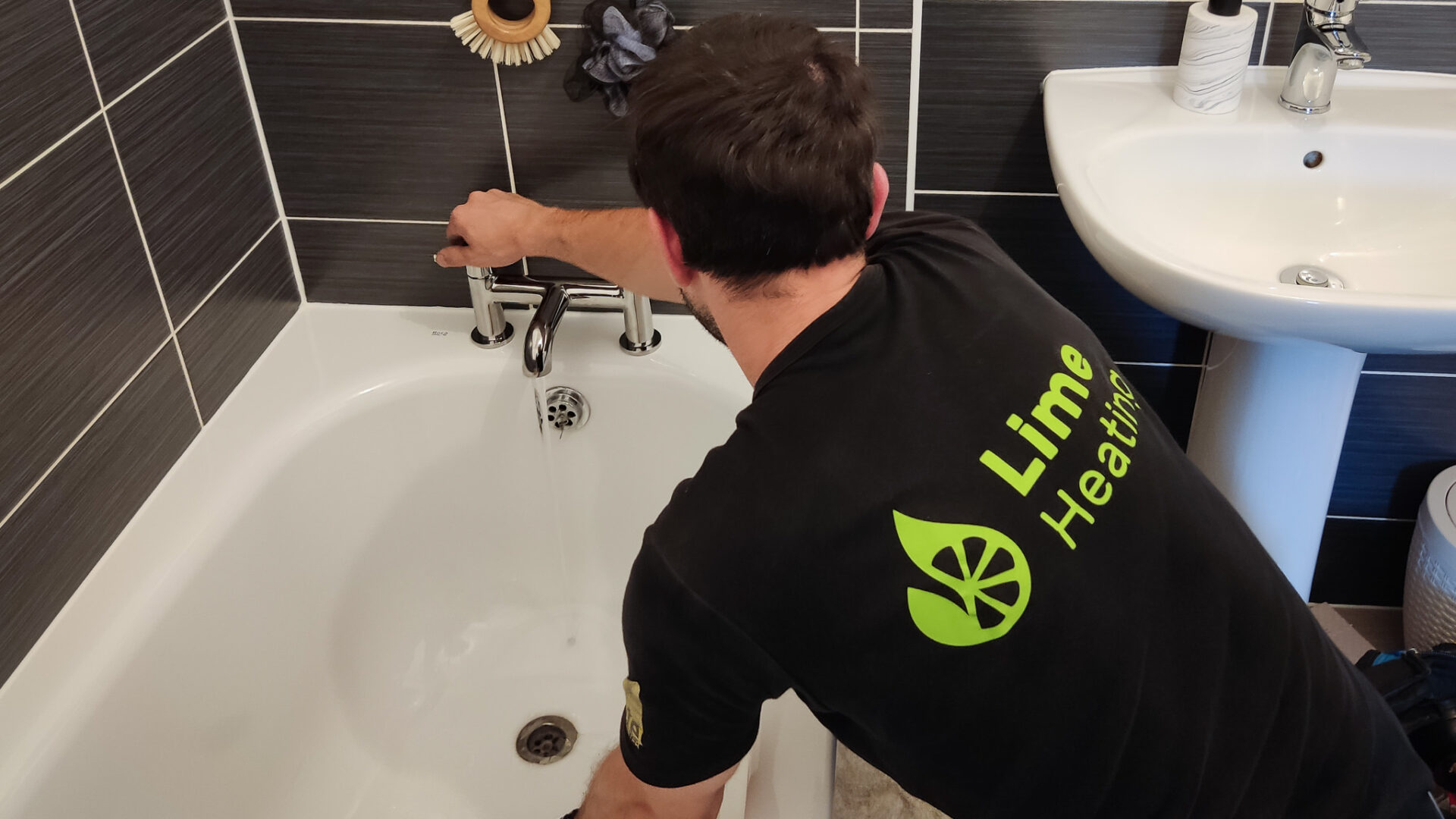Lime Heating plumber repairing a leaking bath in Milton Keynes