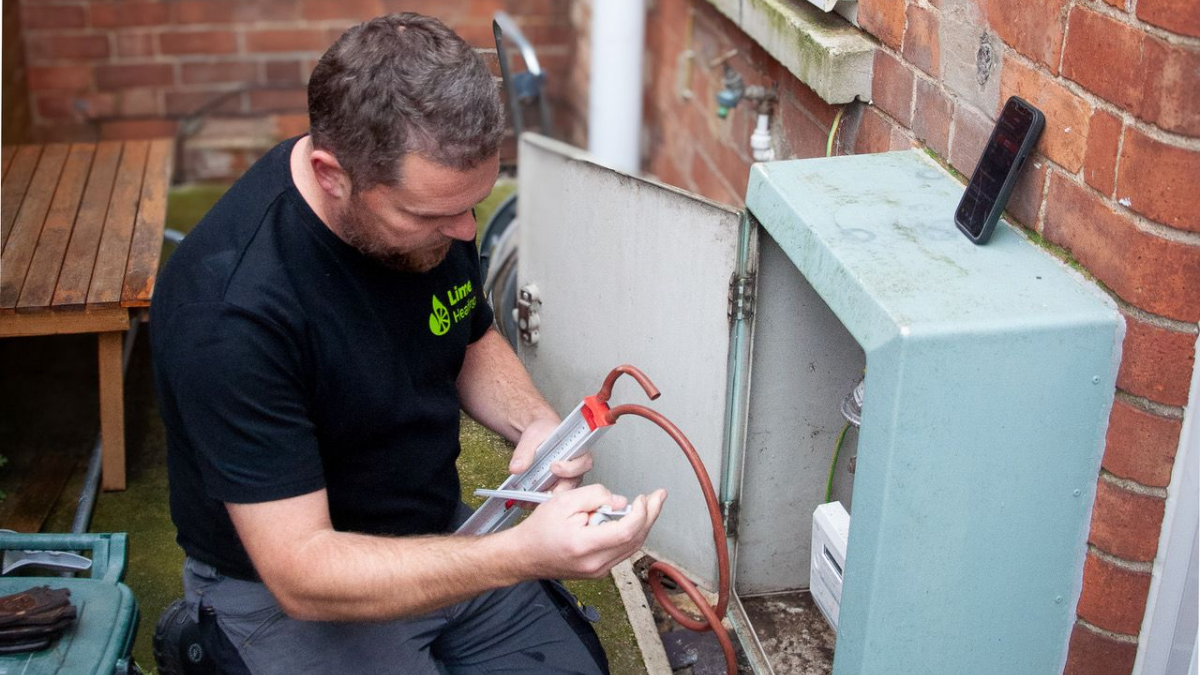 A Lime Heating gas engineer checking a gas meter
