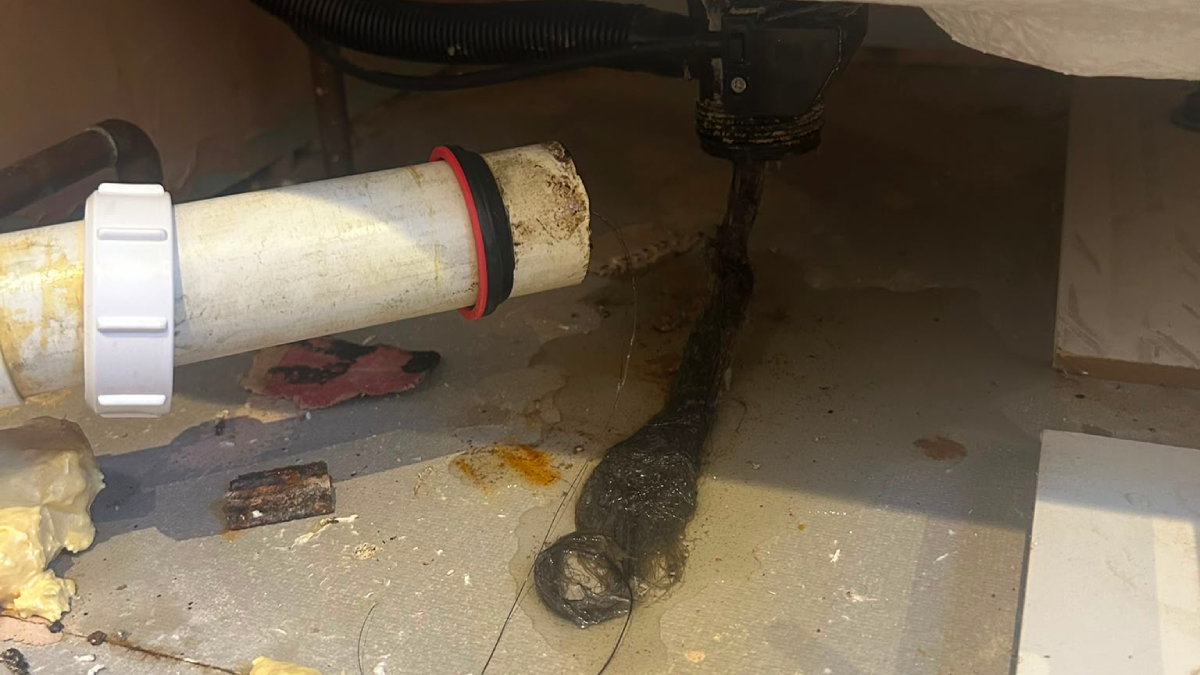 Hair residue causing blocked pipe