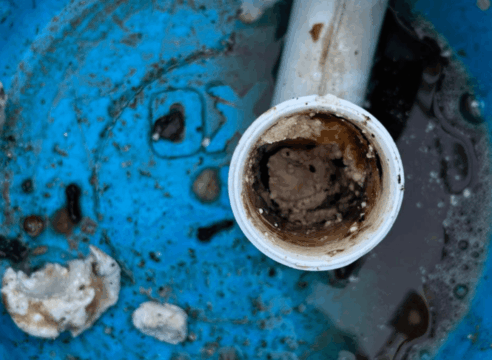 A bucket with a blocked pipe