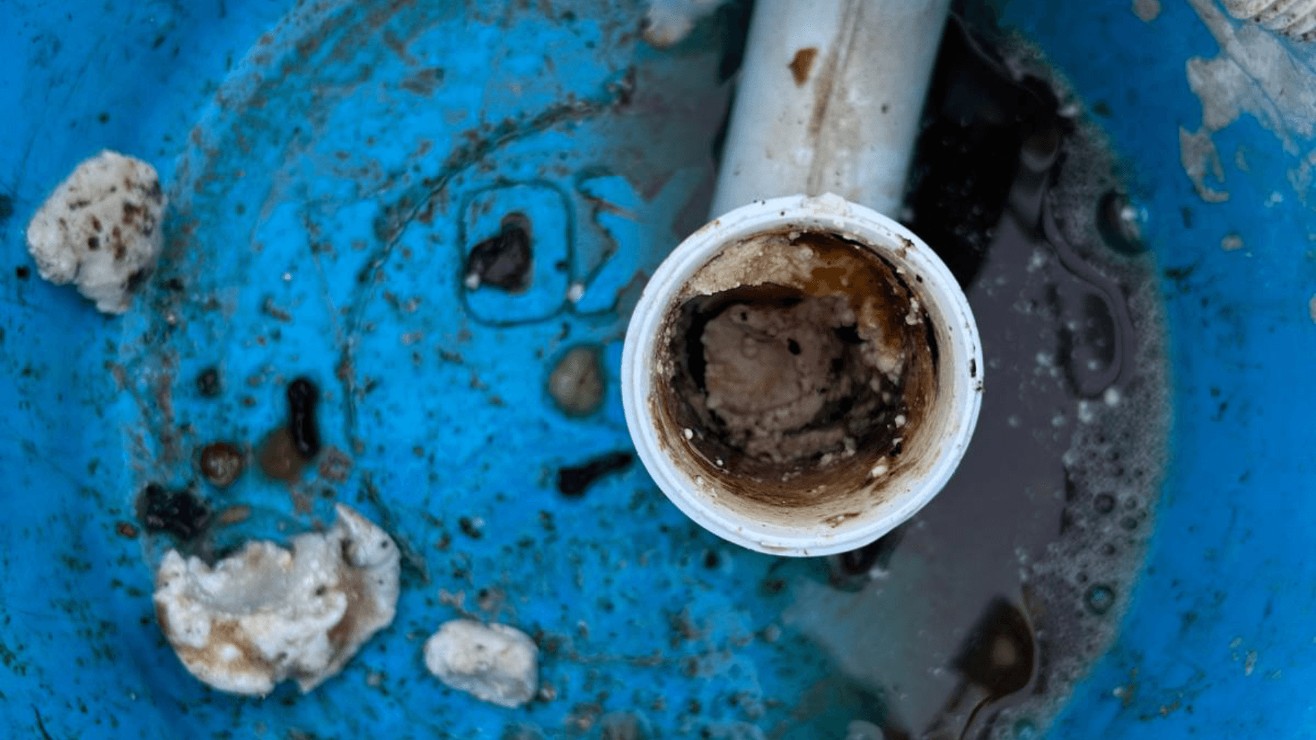 A bucket with a blocked pipe
